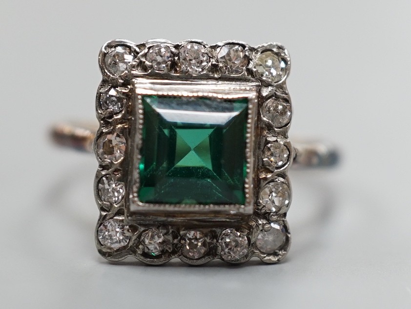 An 18ct gold, green paste? and diamond set square cluster ring, size L, gross weight 2.2 grams.